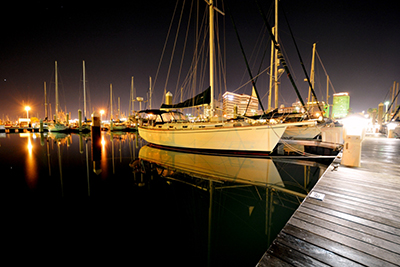 marina boats on calm waters at night